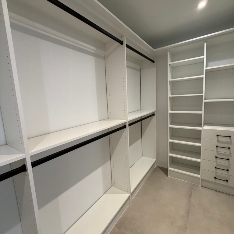 White walk-in with double hanging and a bench – photo 1