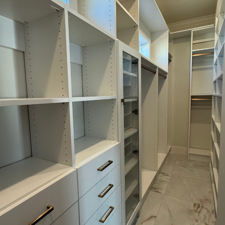 Dressing room with glass-door cabinets and a drawer wall – photo 2